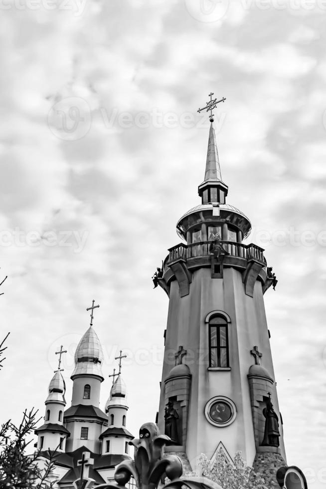 Christian church cross in high steeple tower for prayer photo