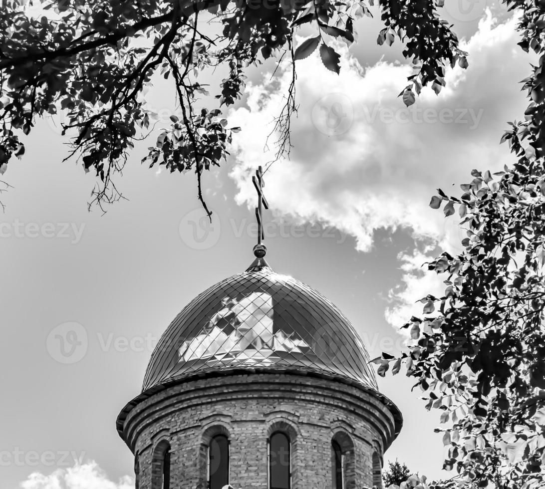 Christian church cross in high steeple tower for prayer photo