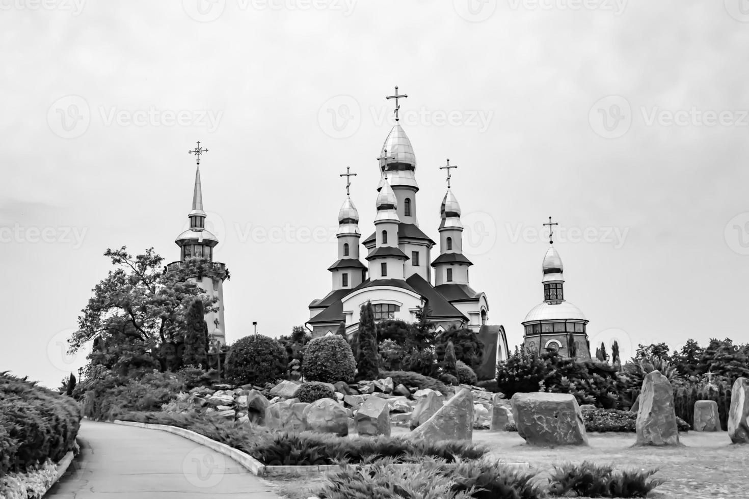 Christian church cross in high steeple tower for prayer photo