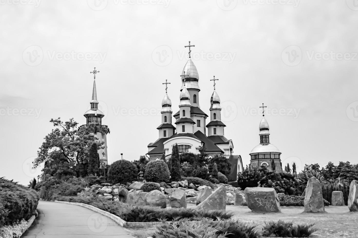 Christian church cross in high steeple tower for prayer photo