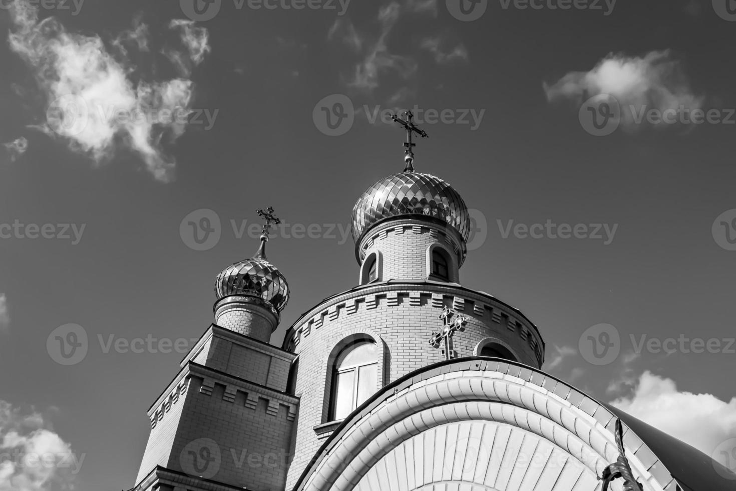 Christian church cross in high steeple tower for prayer photo