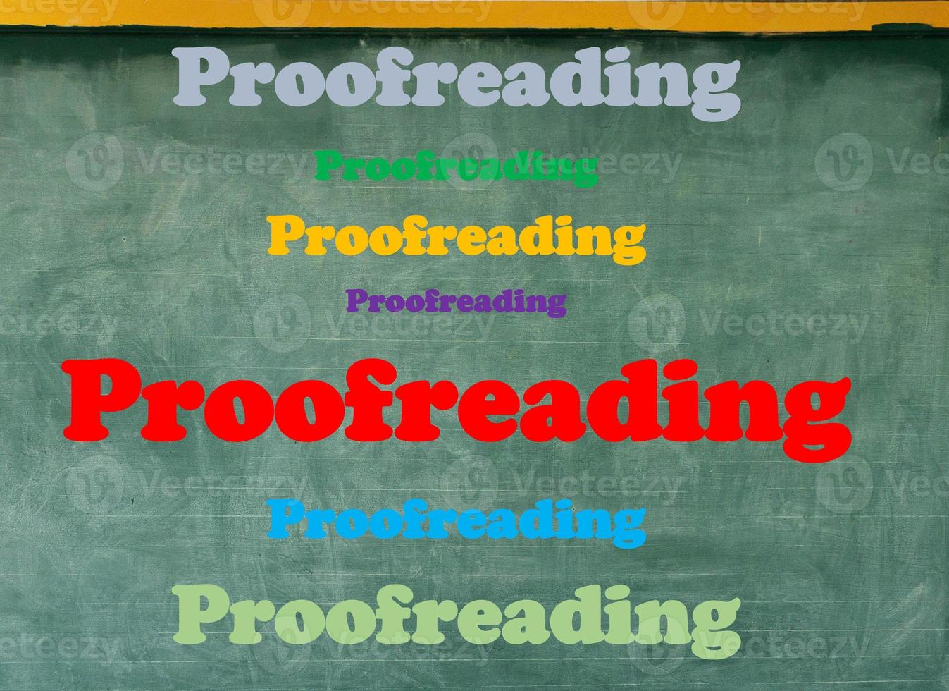 colorful proofreading word on blackboard photo