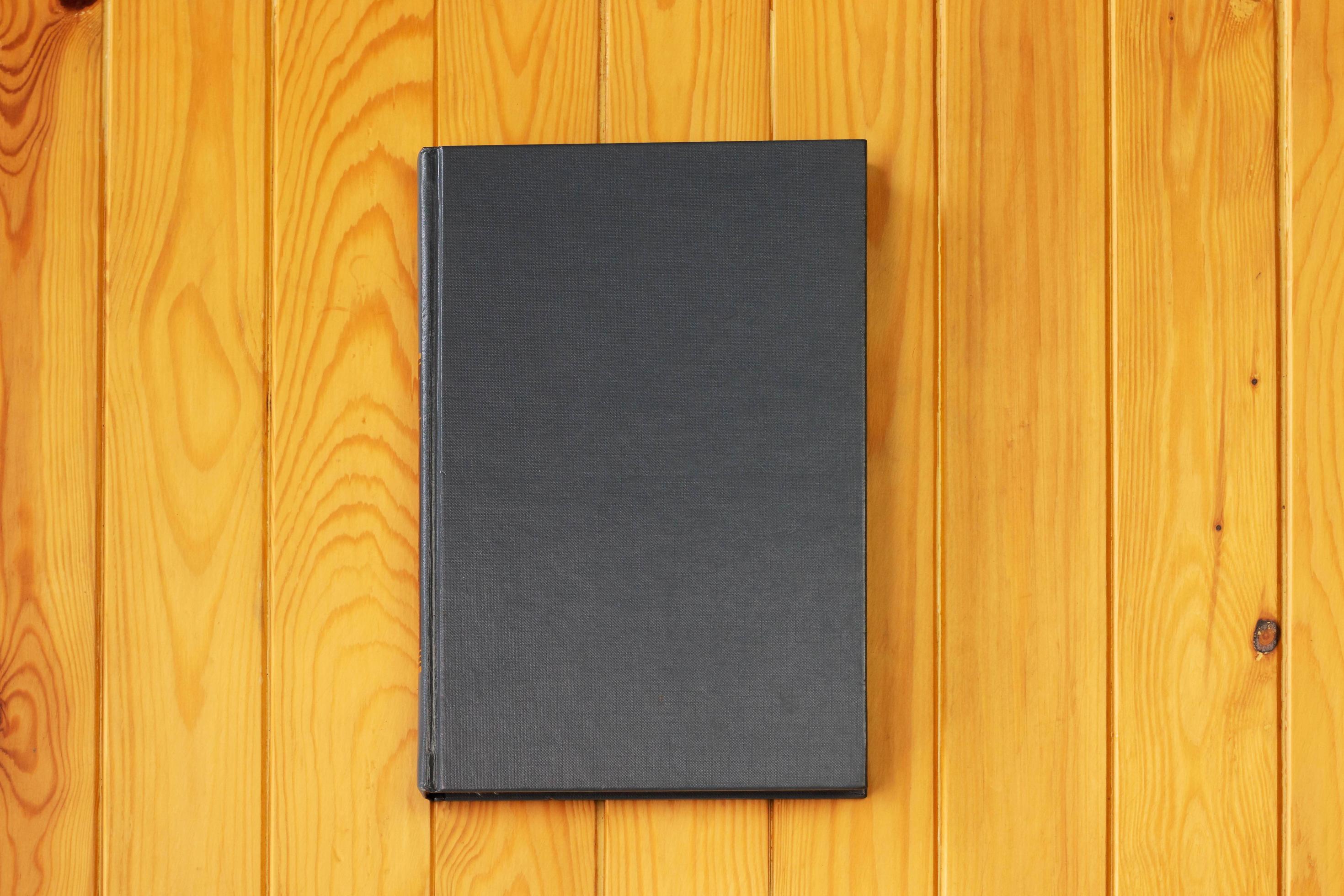 hardcover textbook on wooden table for background 13425452 Stock Photo