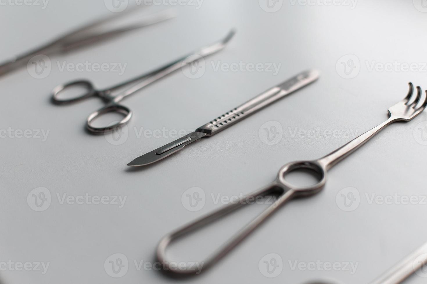 Surgical set on a white table. photo