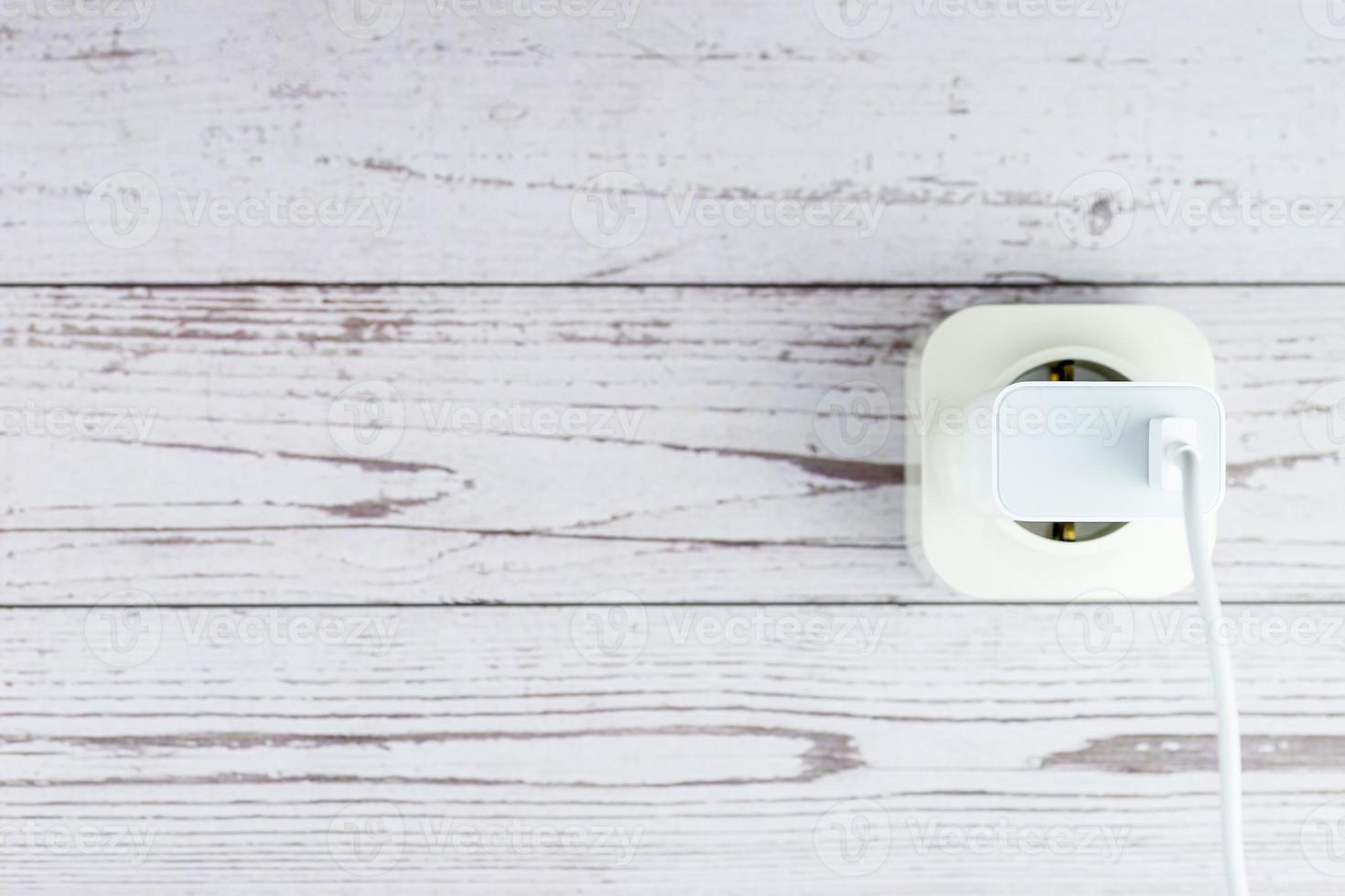 Socket on the wooden wall photo