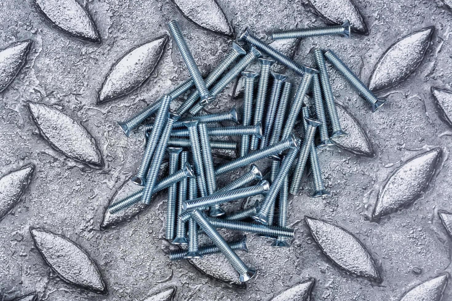 screw on metal background photo