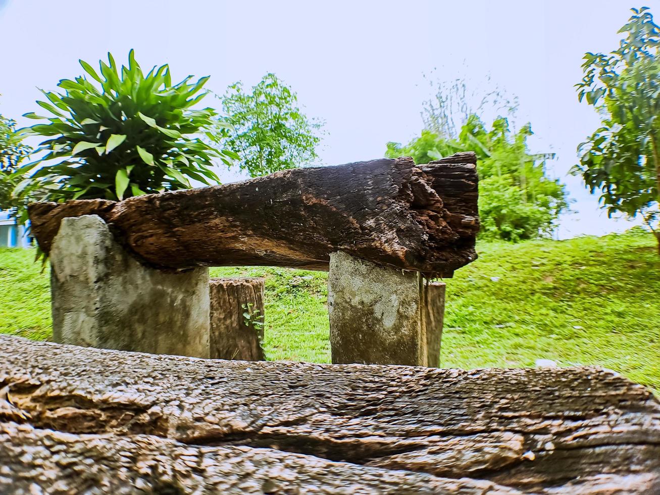 Chairs and tables made of wood pieces in the hospital garden photo