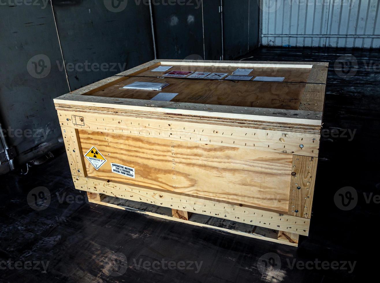 Radiation label beside the transport wooden box Type A package photo
