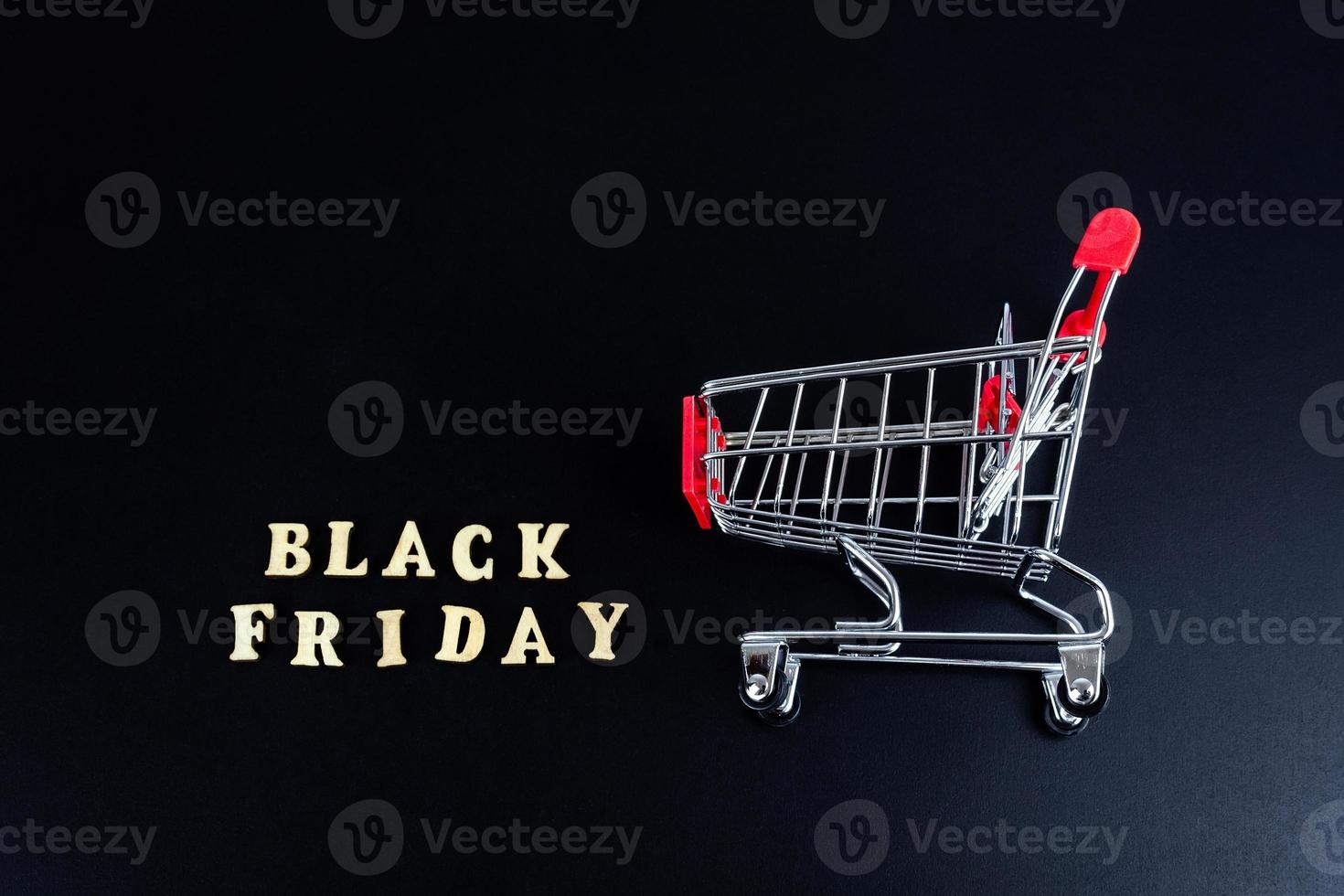 Wooden letters text BLACK FRIDAY in front black background, copy space, banner Top view Flat lay seasonal sale, retail, shopping concept. Black friday sale photo