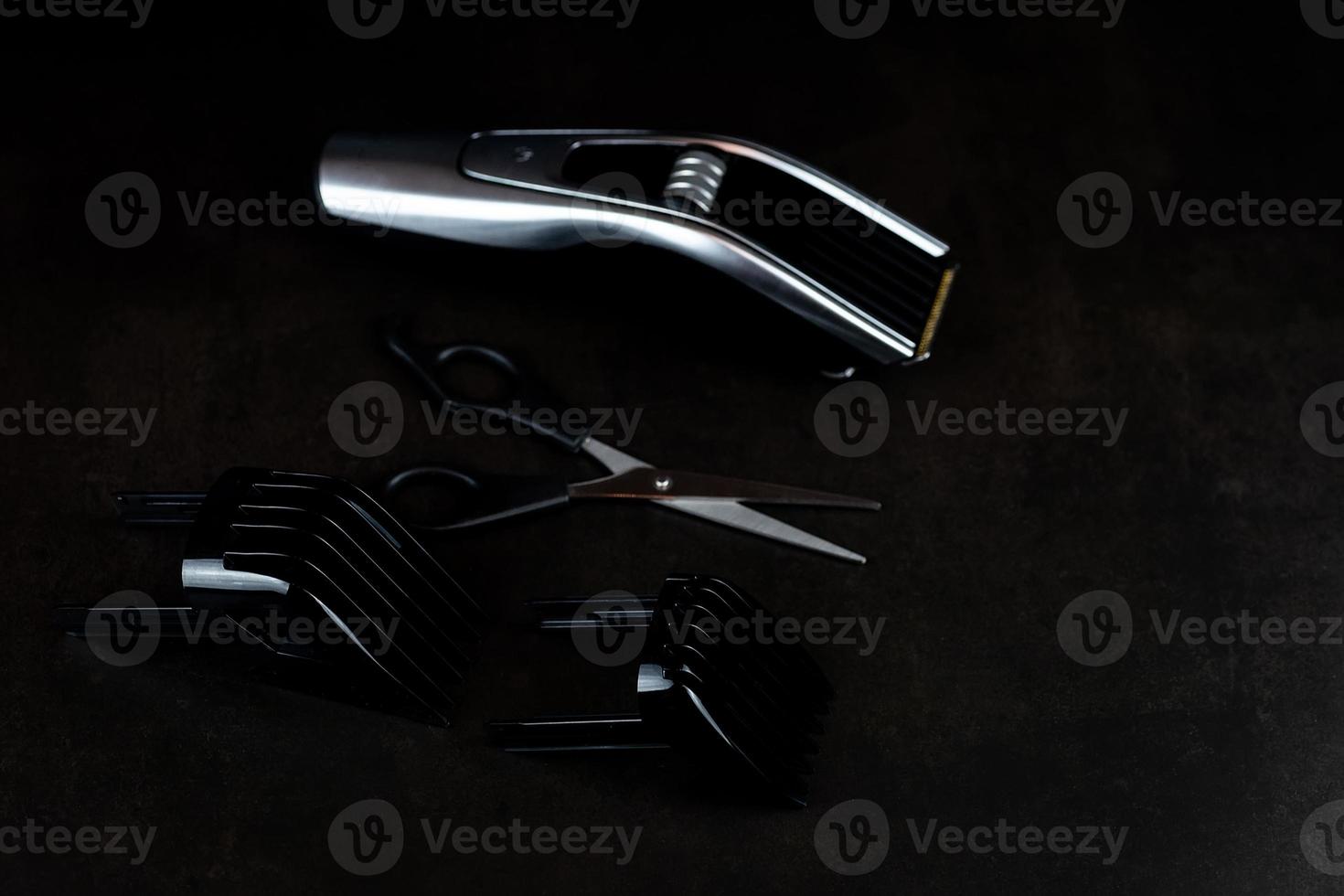 hair clipper black background. photo