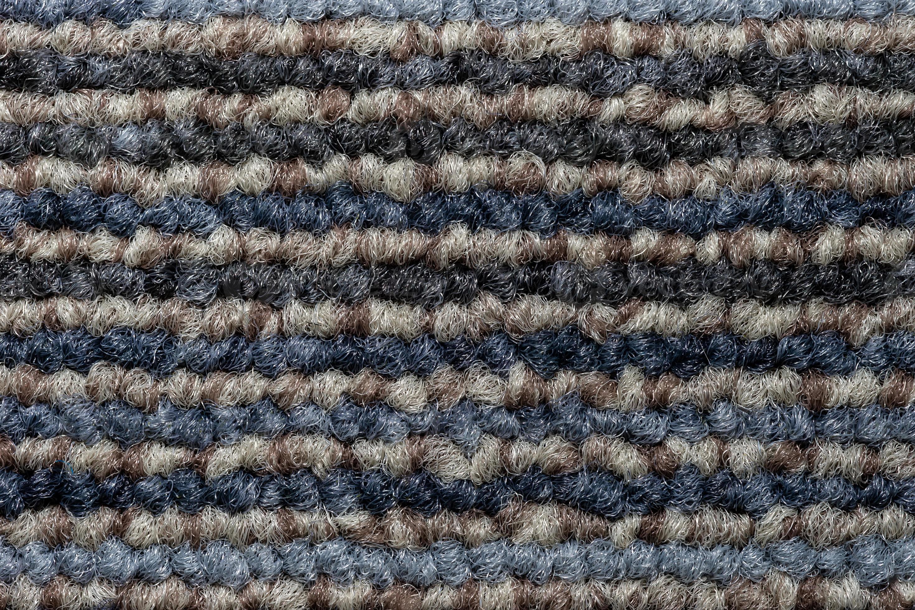 Seamless close up of monochrome grey carpet texture background from