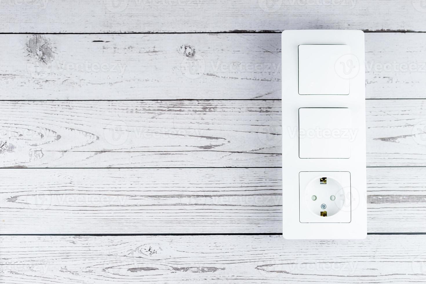 Socket on the wooden wall photo