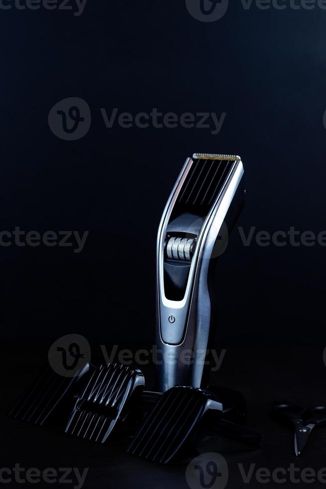 hair clipper black background. photo