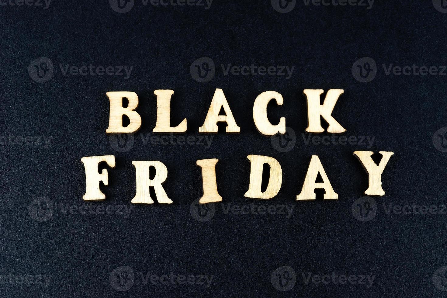 Wooden letters text BLACK FRIDAY in front black background, copy space, banner Top view Flat lay seasonal sale, retail, shopping concept. Black friday sale photo