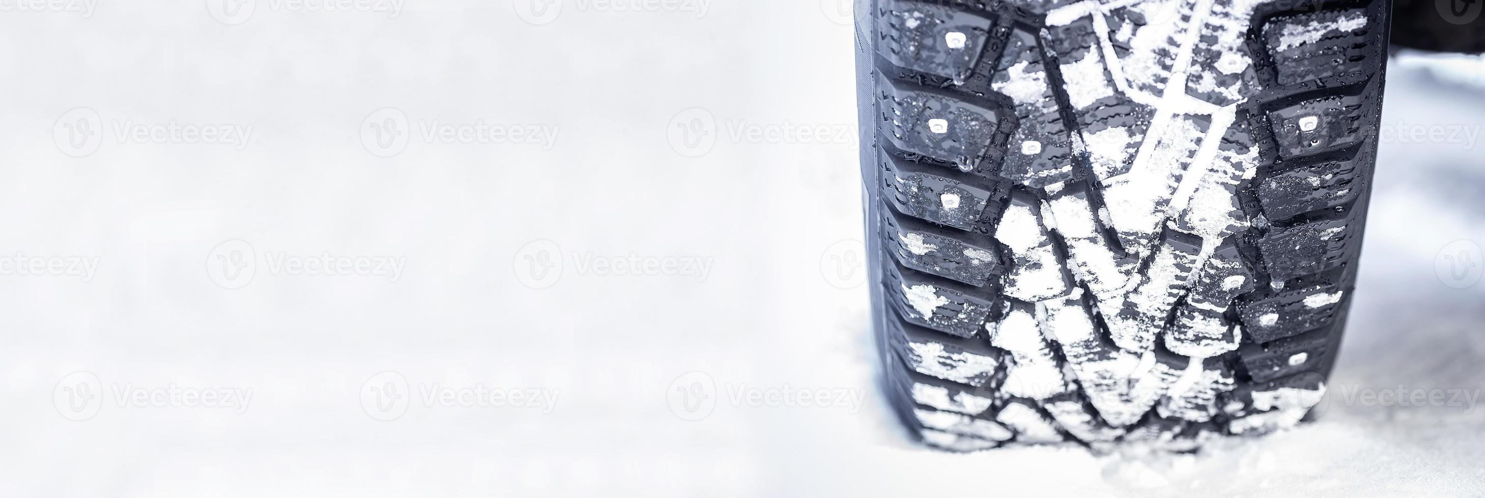 Winter studded tires on snow photo