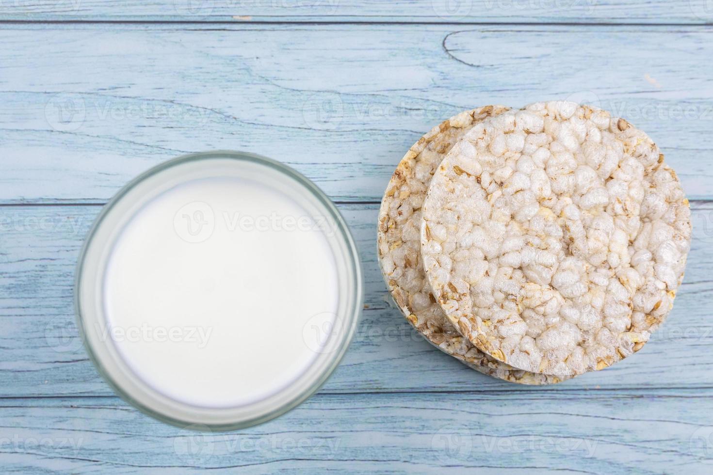 glass of milk with grain crispbreads photo