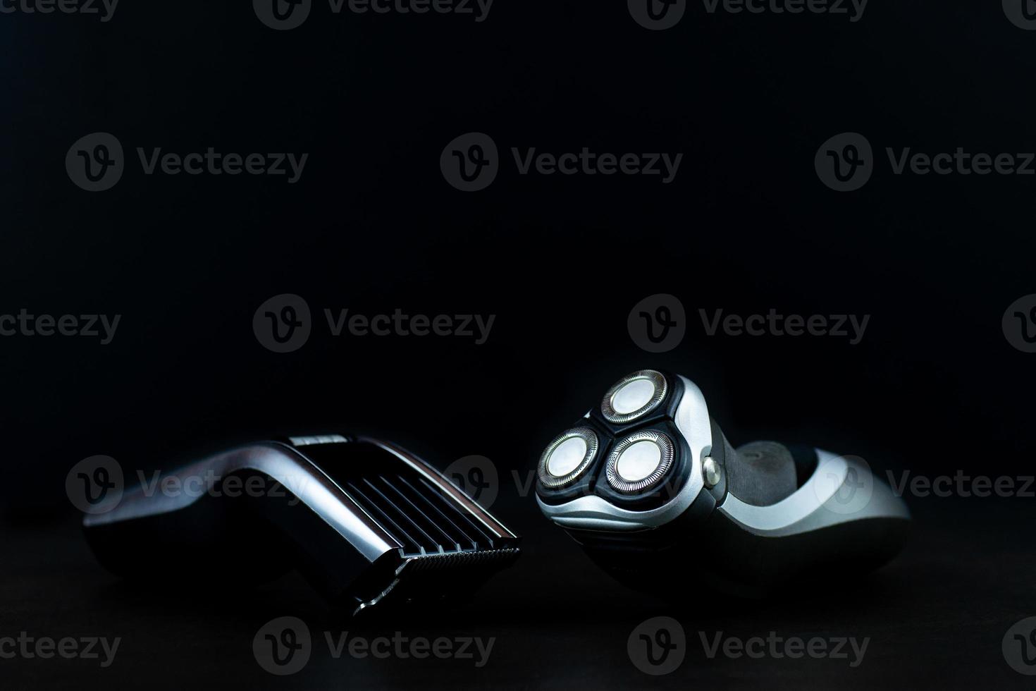 hair clipper black background. photo