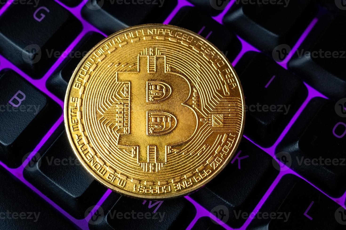 gold bitcoin on the keyboard photo