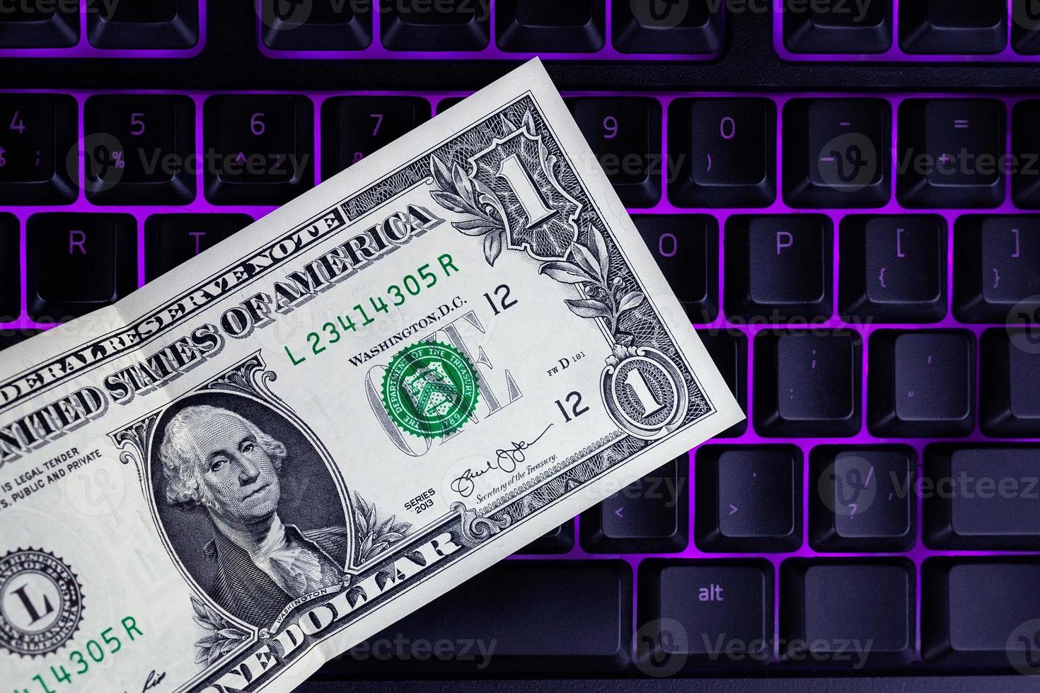 dollar on a black keyboard photo