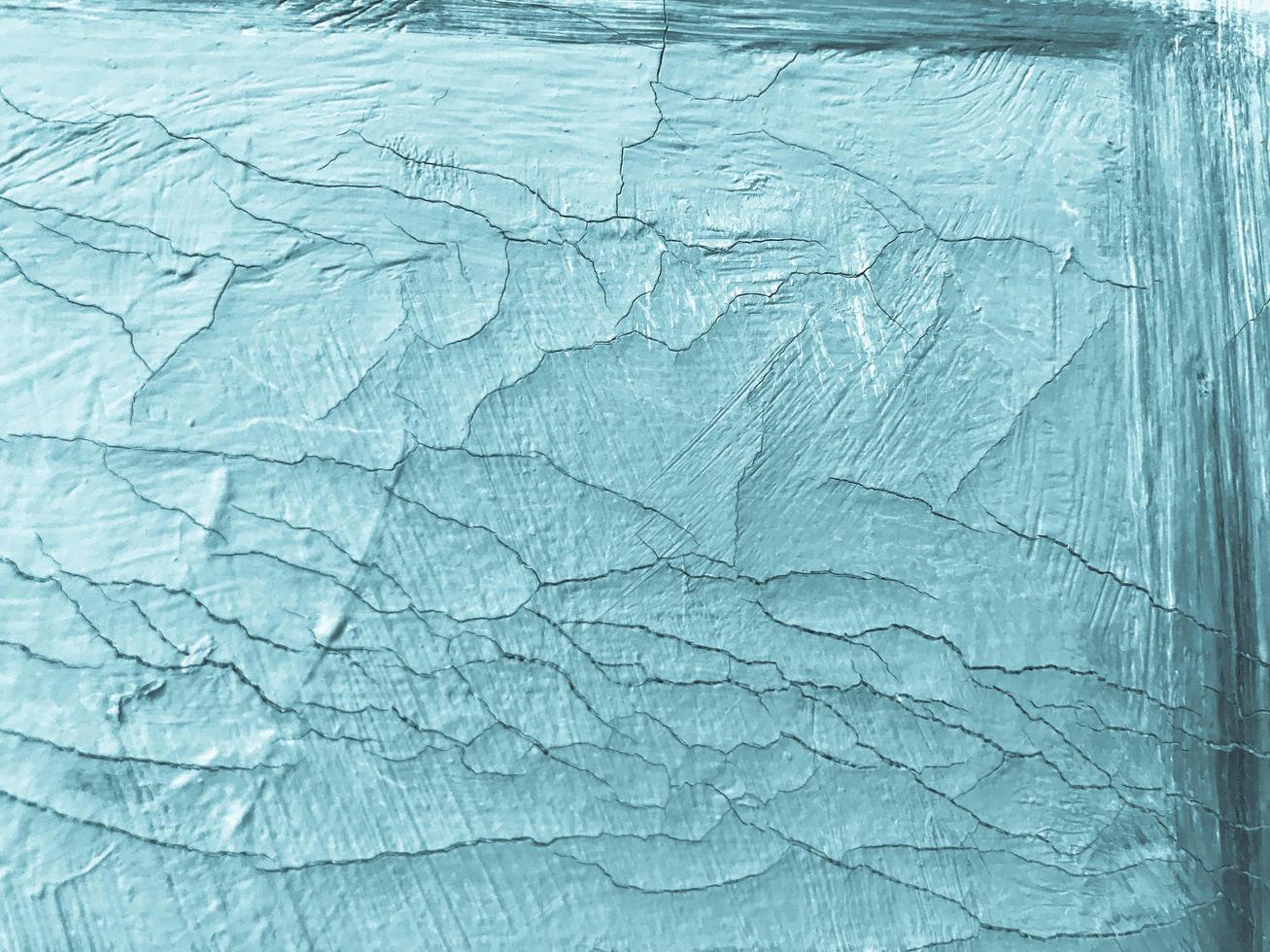 old texture, cracked paint. blue color on the texture. aged, antique texture. background in antique style. heterogeneous, volumetric texture of paint with cracks photo