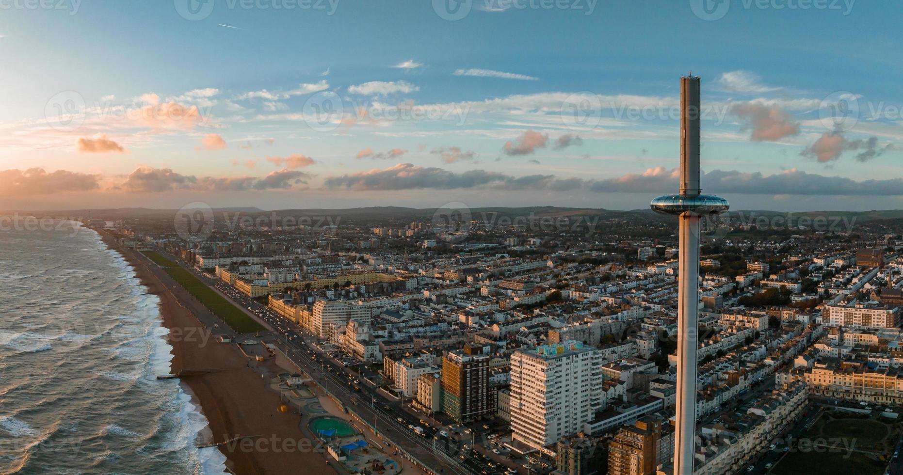 Magical sunset aerial view of British Airways i360 viewing tower pod with tourists in Brighton photo