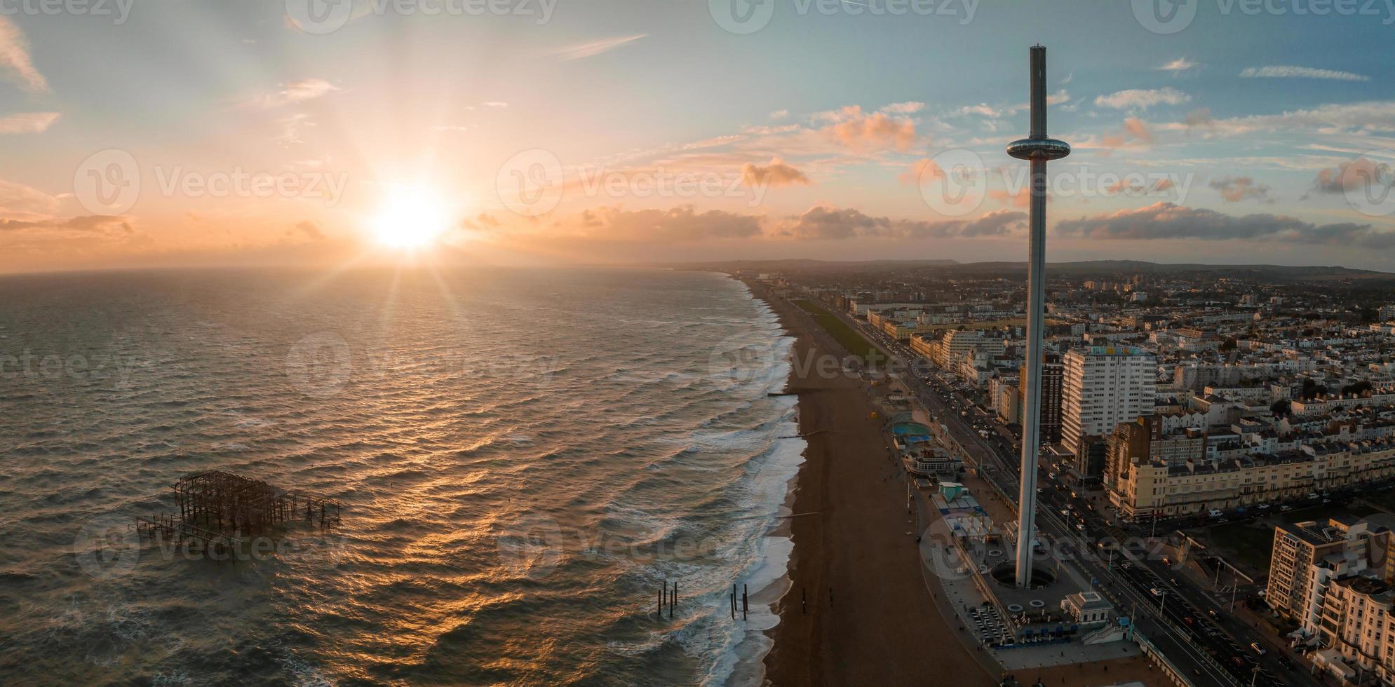 Magical sunset aerial view of British Airways i360 viewing tower pod with tourists in Brighton photo