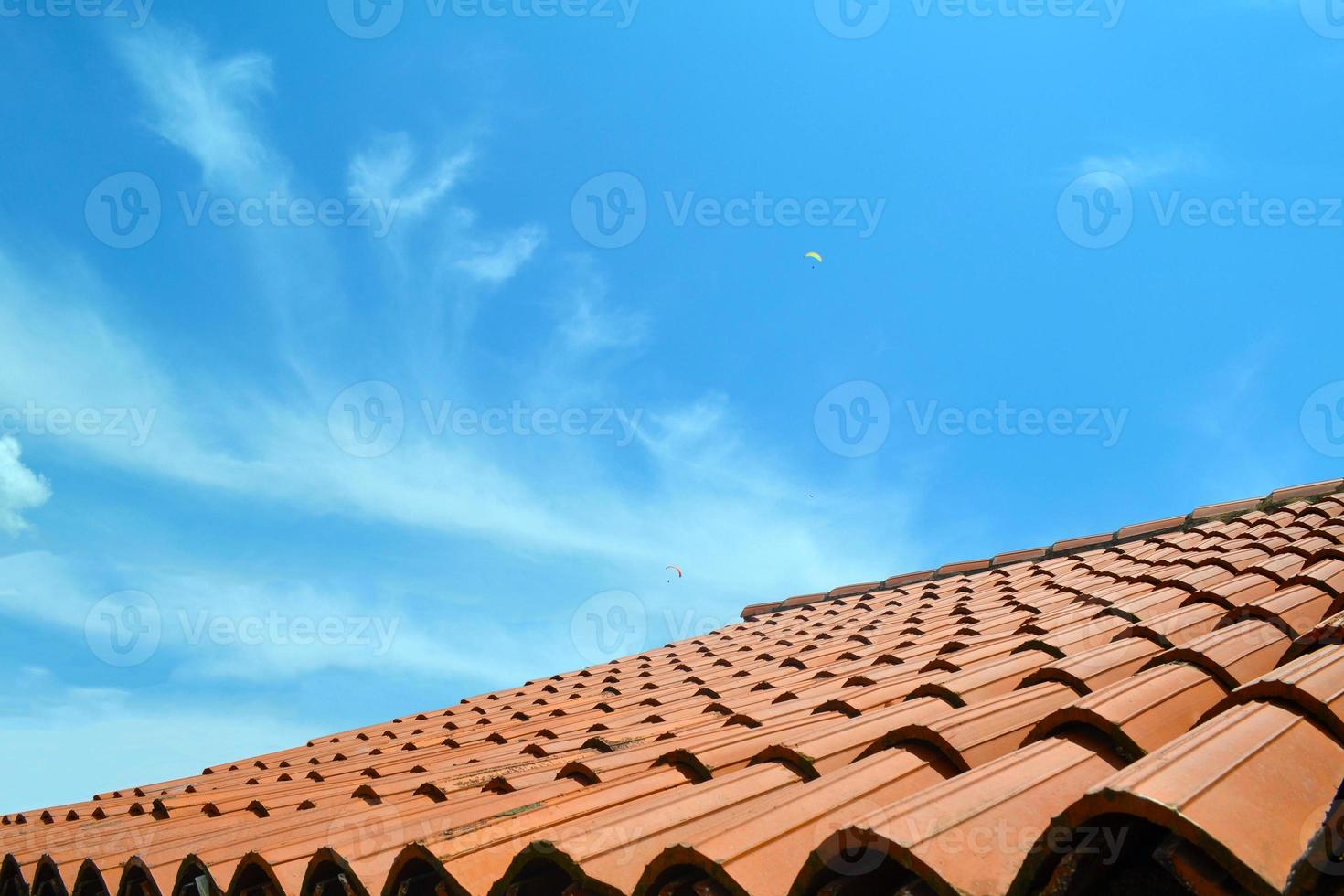 Tiled roof and sky photo