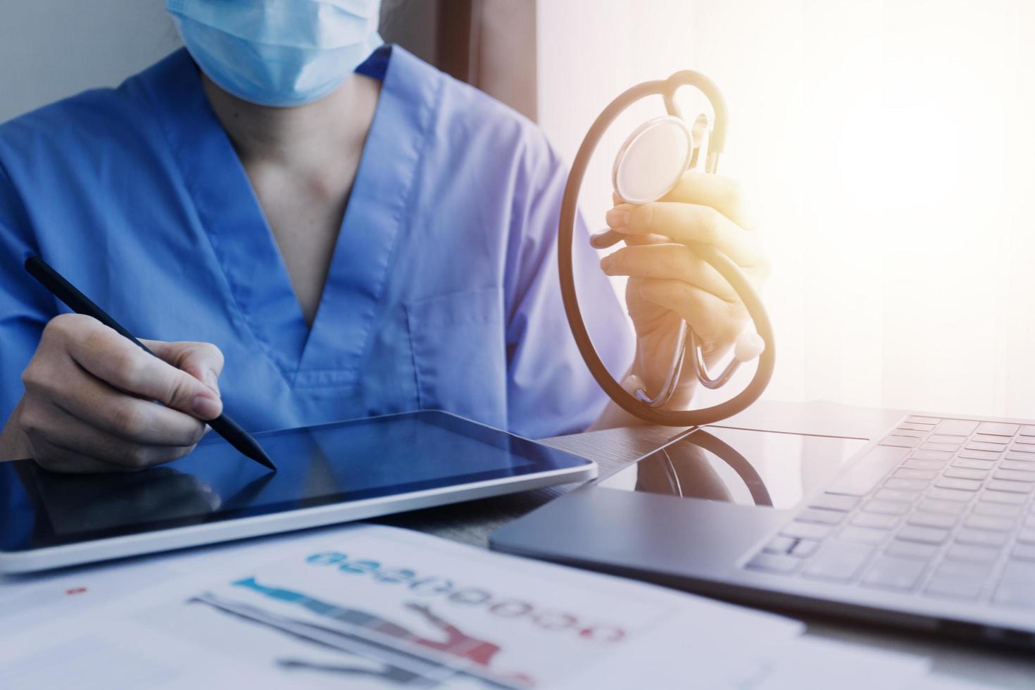 biochemical research scientist team working with microscope for coronavirus vaccine development in pharmaceutical research labolatory, selective focus photo