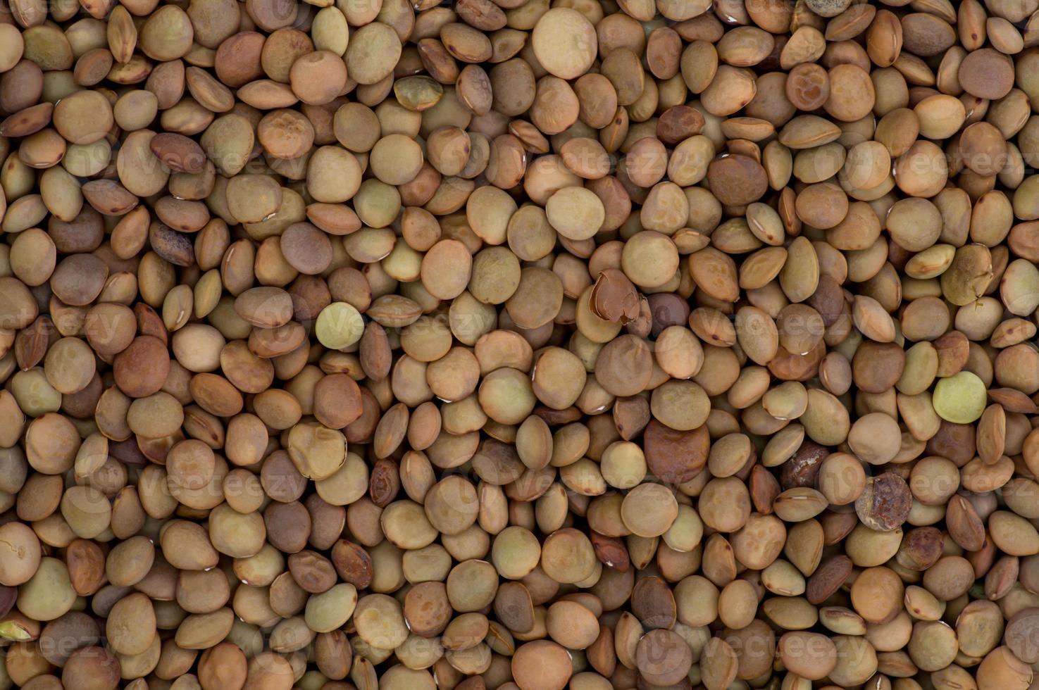 High angle full-frame photo of lentil grains making pattern for background, wallpaper