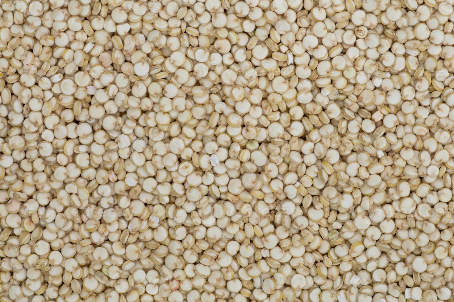 High angle full-frame photo of wholegrain quinoa grains making pattern for background, wallpaper