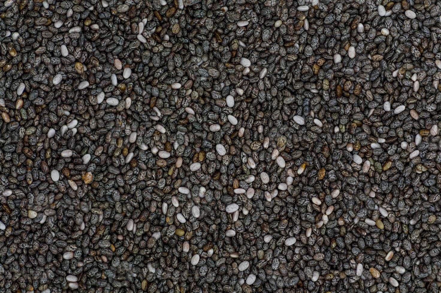 High angle full-frame photo of Chia seed grains making pattern for background, wallpaper