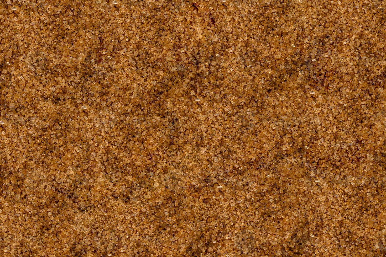 foto de marco completo de ángulo alto de granos de azúcar moreno que hacen un patrón para el fondo, papel tapiz