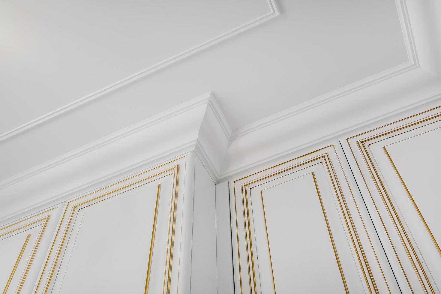 Detail of corner ceiling cornice with intricate crown molding. photo