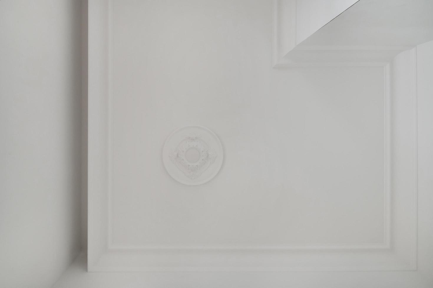 Detail of corner ceiling cornice with intricate crown molding. photo