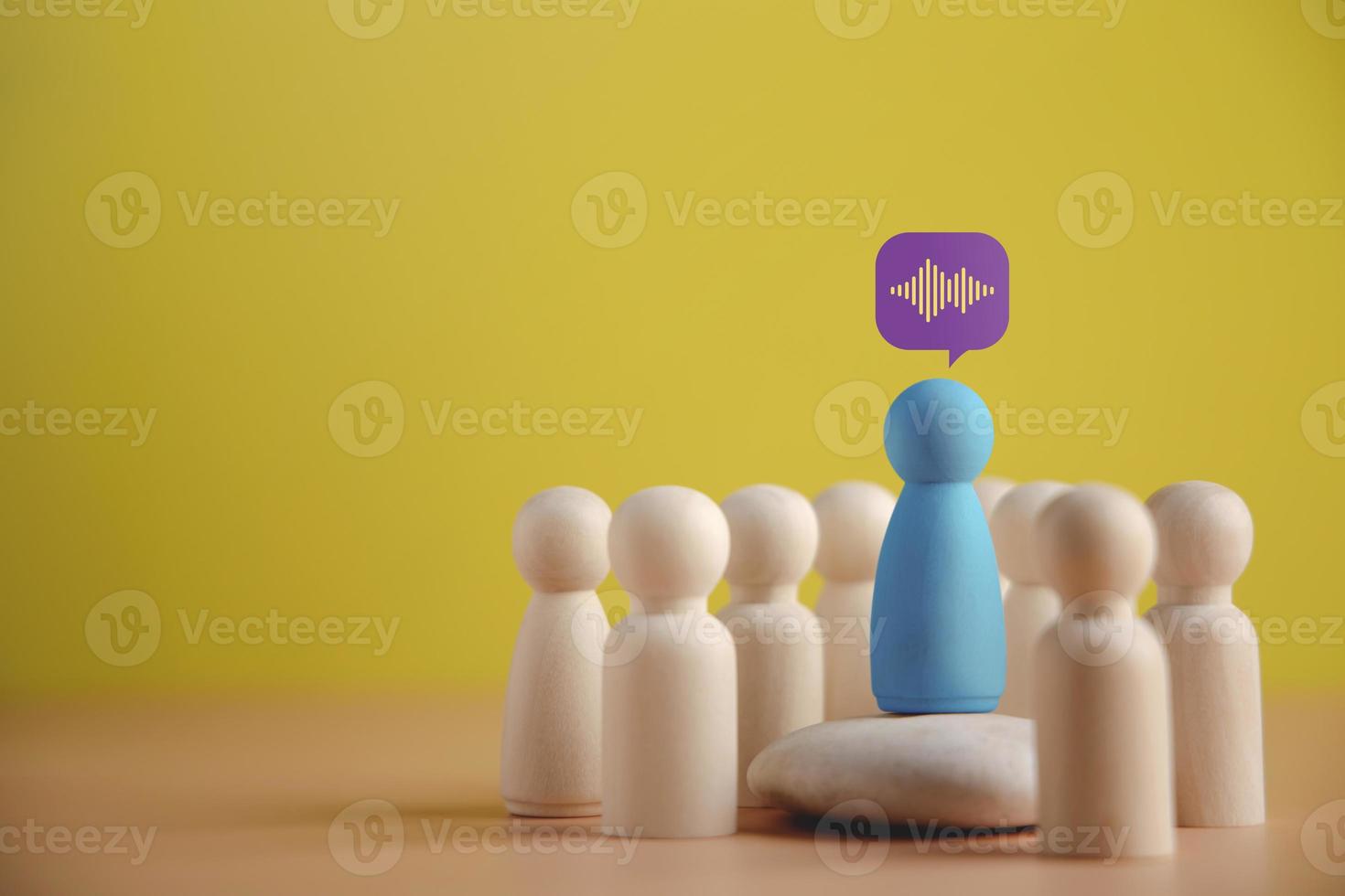 Leader or Coach Speaker Concept. Mentor Explaining Strategy with Team in Meeting Room. presenting by wooden peg dolls photo