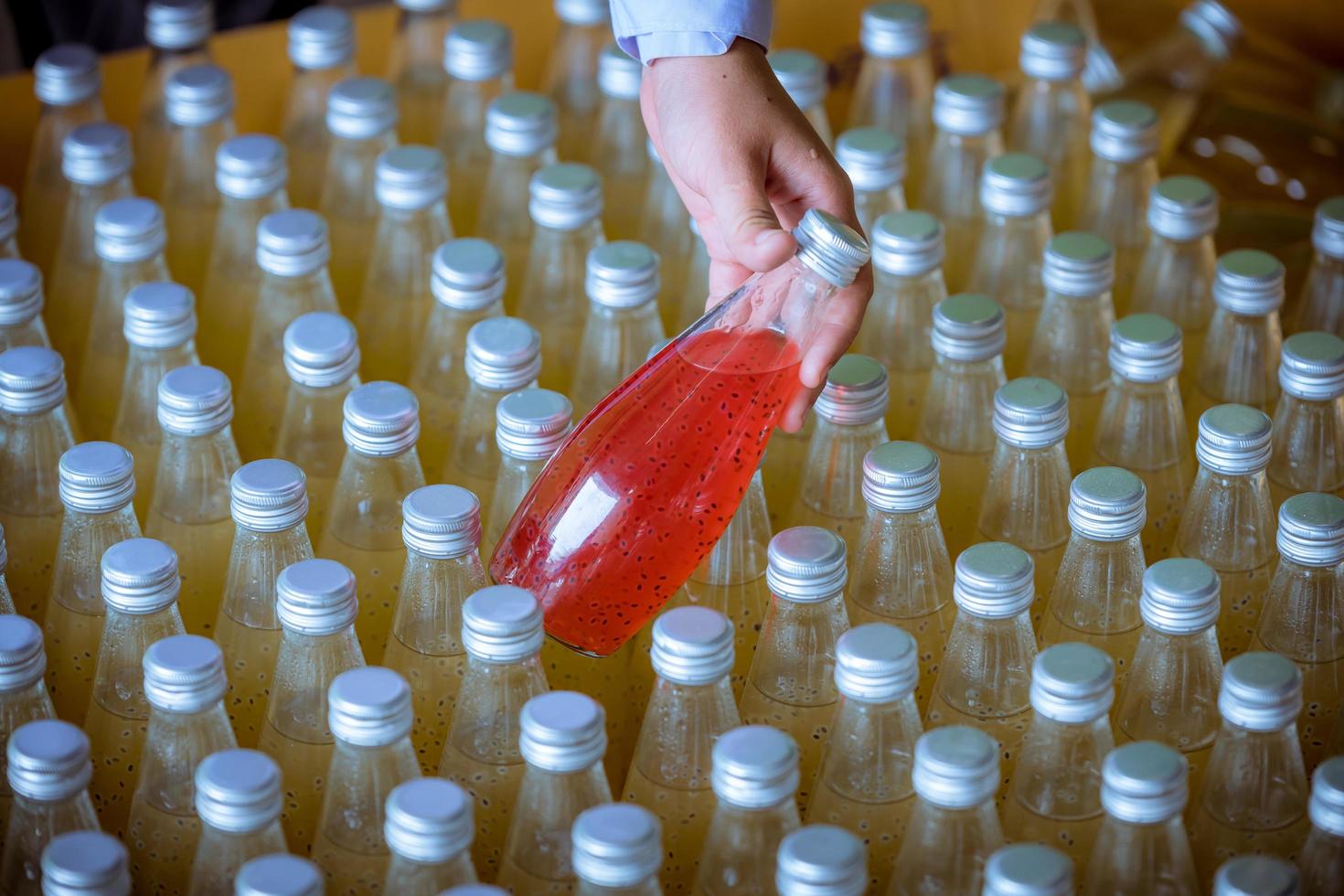 Bottles from Basil seed beverage factory conveyor belt with bottles for juice or water to distribution in business. photo