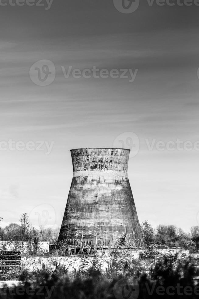 Decaying disused industrial chimney.Concept of environmental sustainability and ecological transition photo