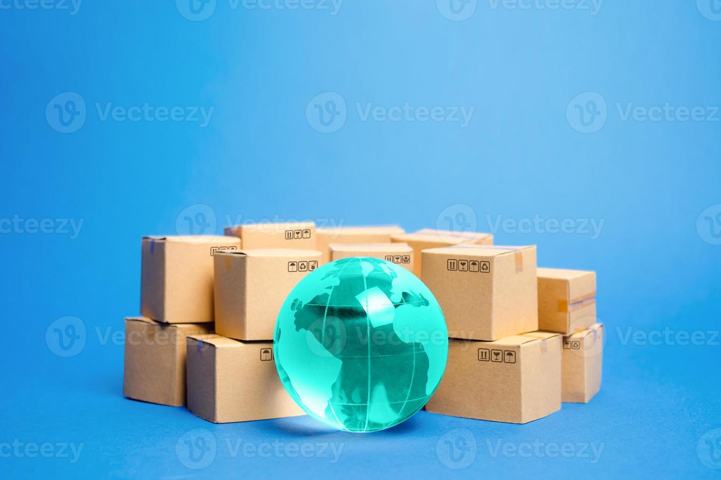 Earth globe is surrounded by boxes. Global business and international transportation of goods products. Shipping freight, world trade and economics. Distribution, import export. Commodity turnover photo
