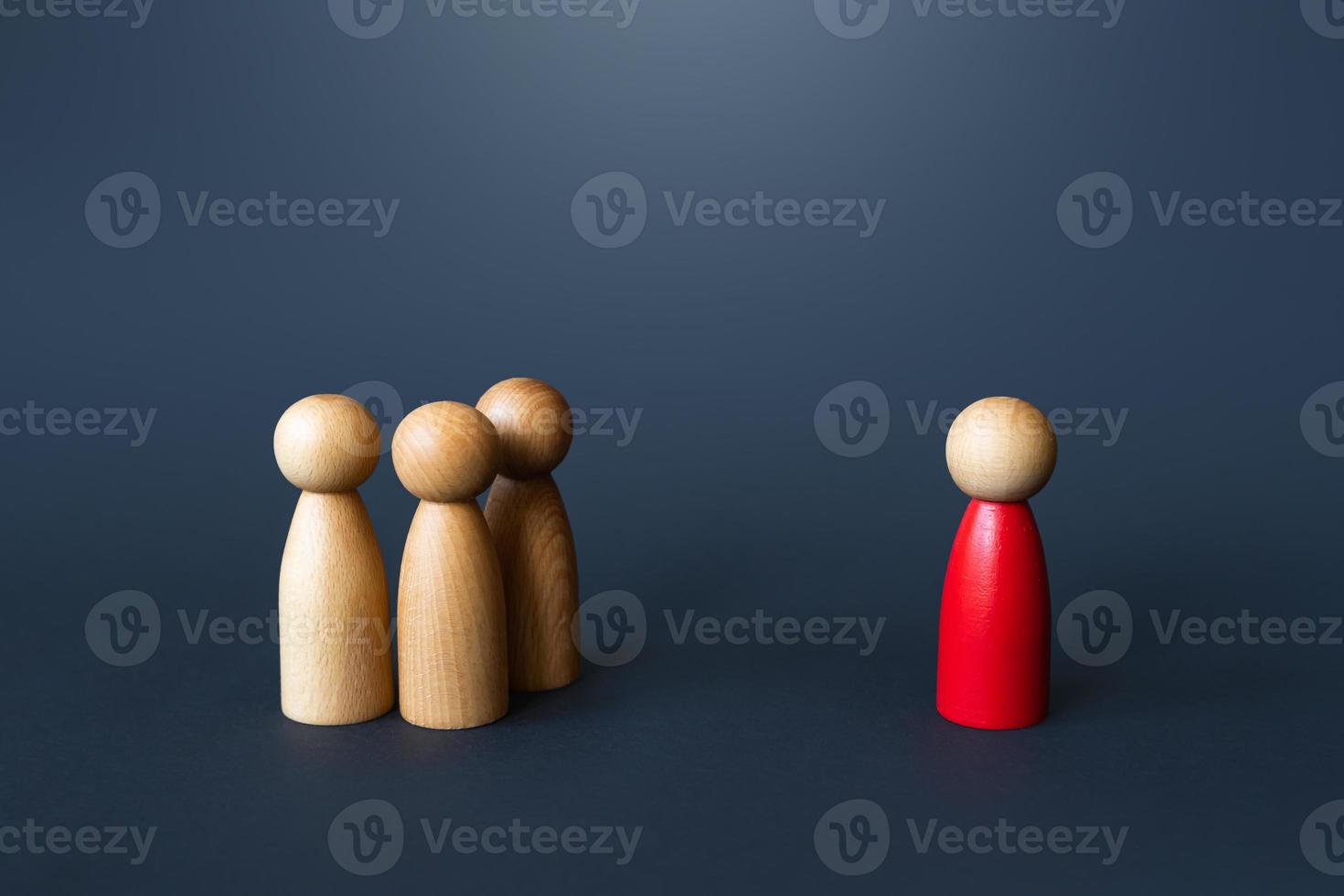 A red man approaches a group of people. Become the leader of the group and win their loyalty. Bullying and threats. Resist the majority. Influence and control. Luring. Seek for support. photo