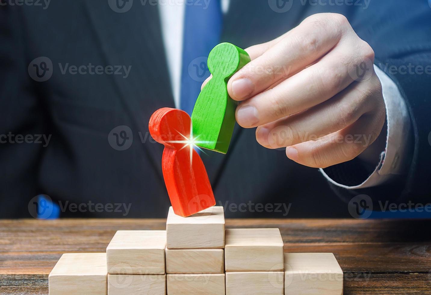 Businessman official displaces an incompetent employee with new person. Head Offset Revolution. Business optimization. Fight corruption. Change of power, capture control of business. System recovery photo