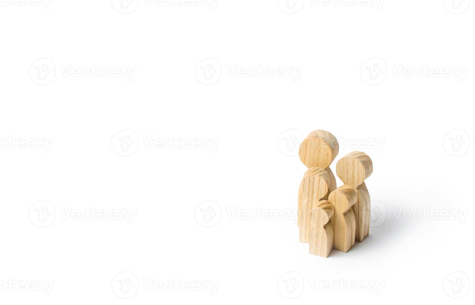 Wooden figurines of the family on a white background. Family values and health. Adoption and custody of children. Social support, demography, sociology. Upbringing and education. Together concept photo