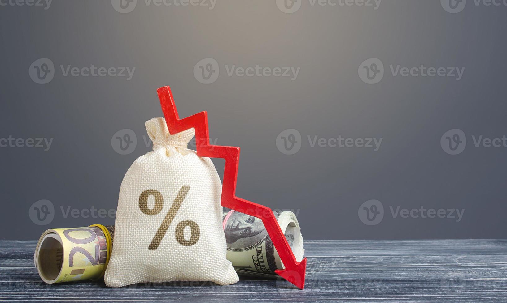 Money bag interest rate and red arrow down. Favorable offers on deposits. Cheap loans for economic business growth. Central bank discount rate. Diversification, decrease in foreign currency borrowing. photo