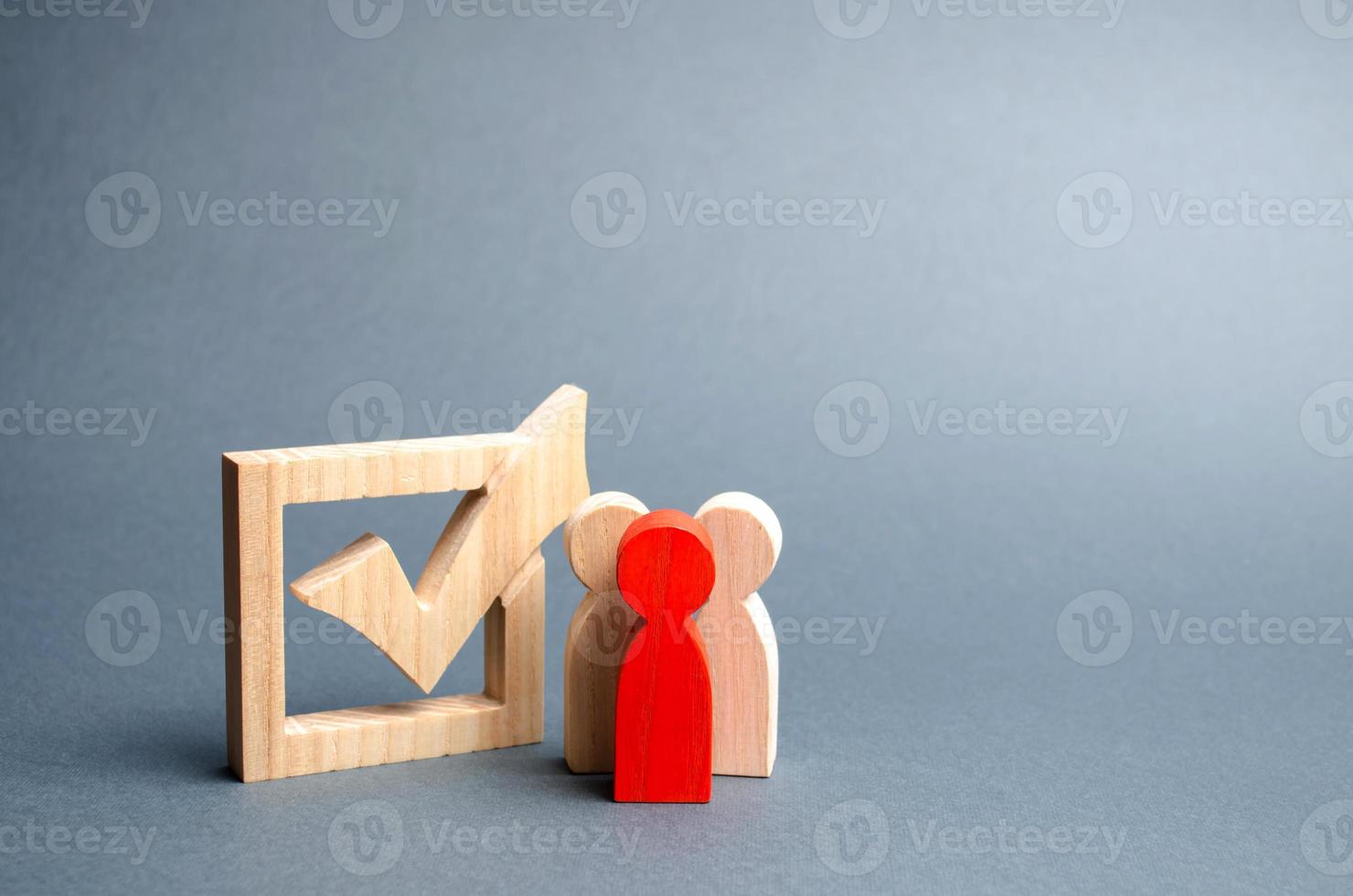 people stand near the checkbox for voting in elections. Lobbying interests, election corruption, voter bribery, and rigging election results. Presidency or parliamentary elections. Selective focus photo