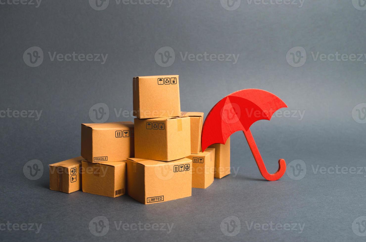 A bunch of cardboard boxes and umbrella. concept of insurance purchases. Providing warranty on purchased products. Consumer rights Protection. Support of the national manufacturer by government photo