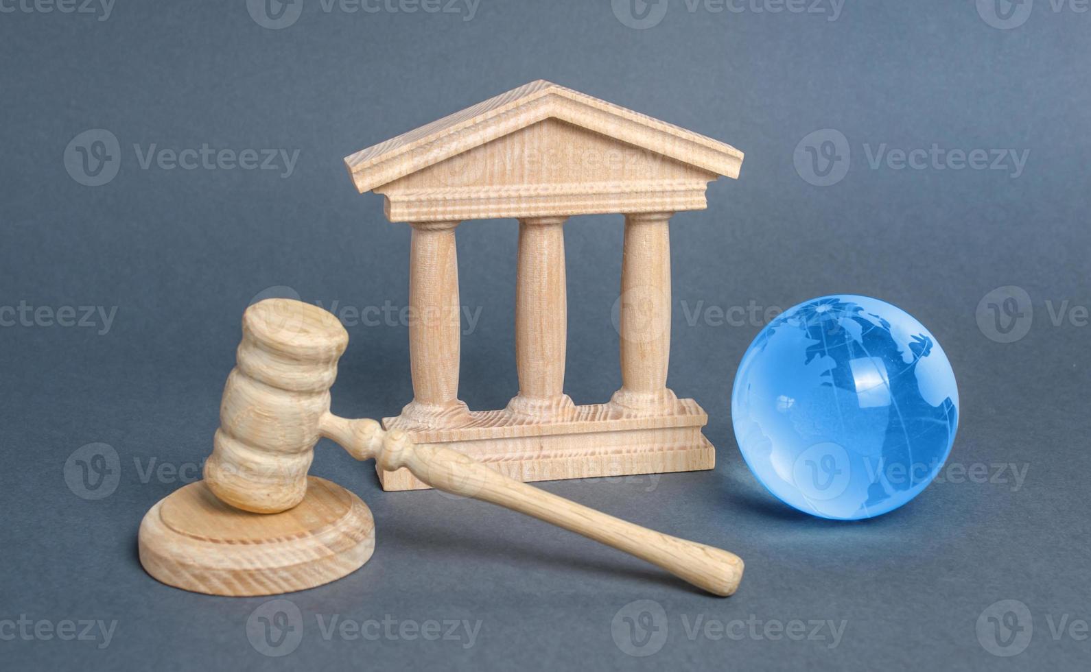 Courthouse, gavel and blue globe planet earth. International Court. Protection of business interests and human rights. international conventions and treaties. supreme photo