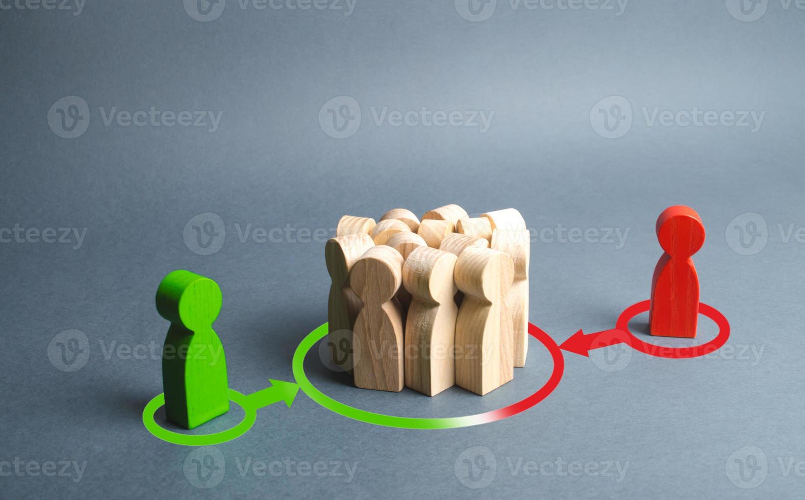 red and green figures of people influence the crowd. Pressure, influence on public opinion, communicating, point of view, mind control. Control media, election campaign, debate. change to their side photo