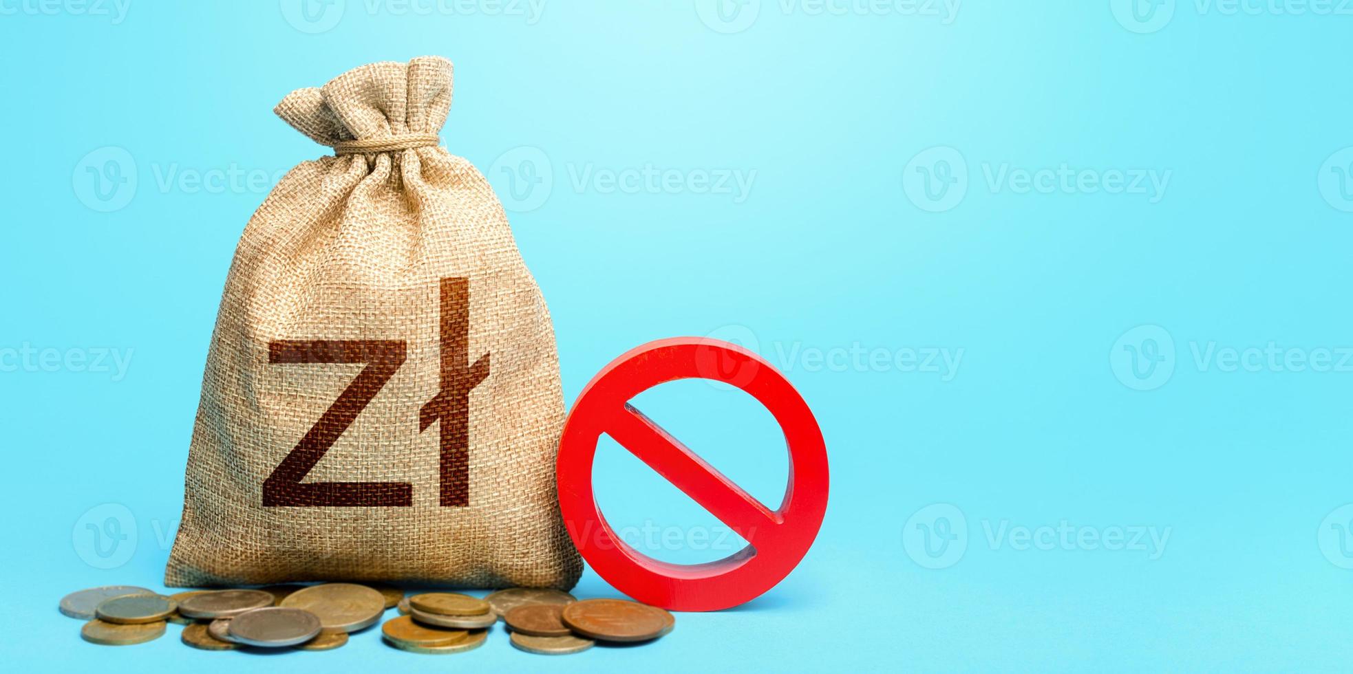 Polish zloty money bag and red prohibition sign NO. Monetary restrictions, freezing of bank accounts. Confiscation of deposits. Termination projects. Monitoring suspicious money flows. photo