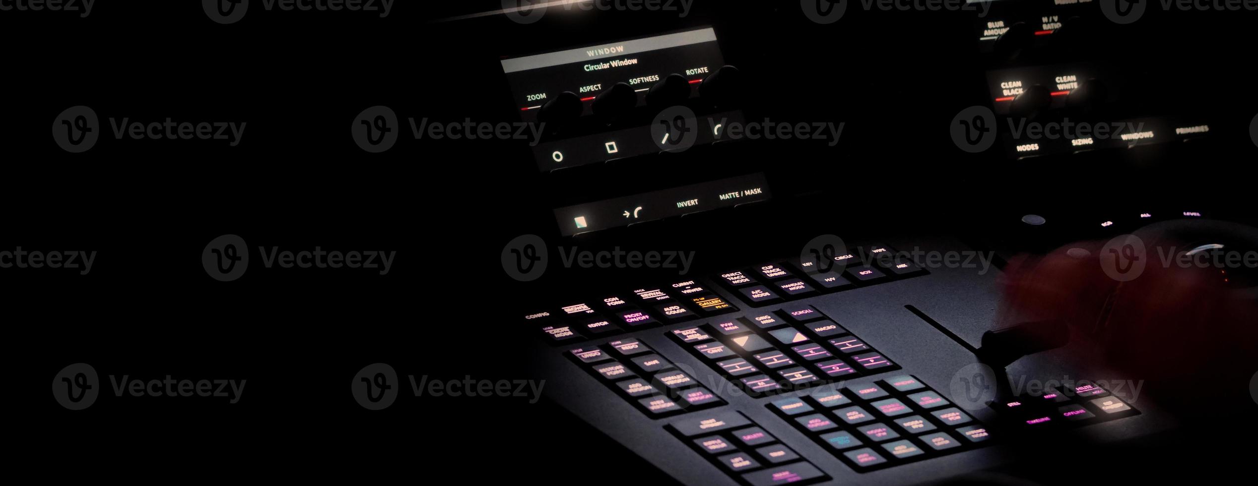 Edit video production control panel in studio. Editor editing and grade film in movie post room. photo