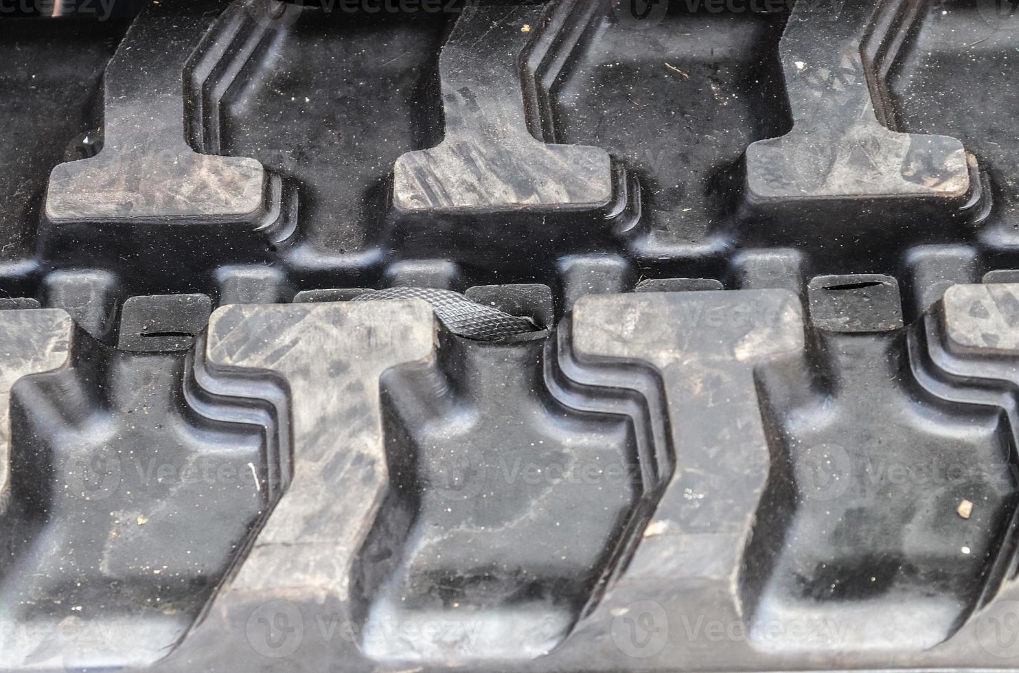 Close up view at almost new black tire treads photo