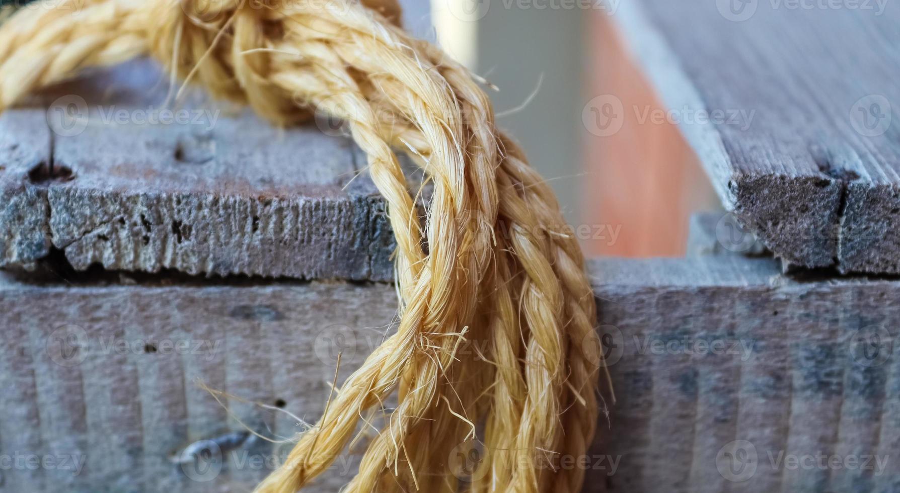 Old rope bound around an old vintage box in a close up. photo